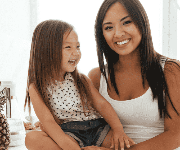 happy little girl and mom laughing