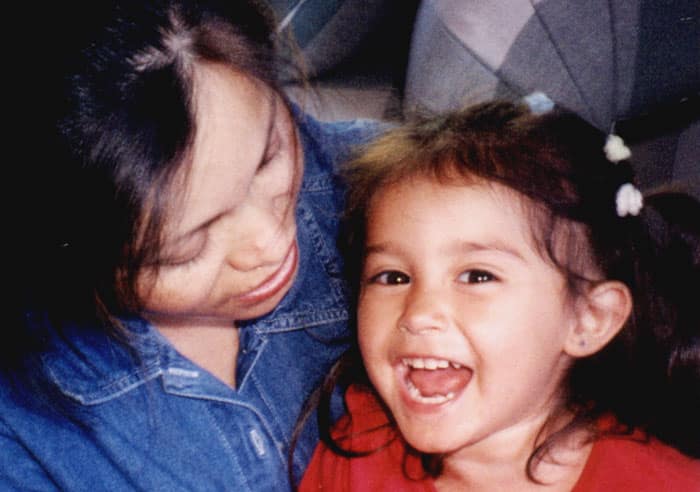 Happy child feeling safe with mom