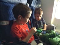 siblings travel plane