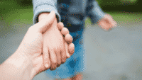 Holding child's hand