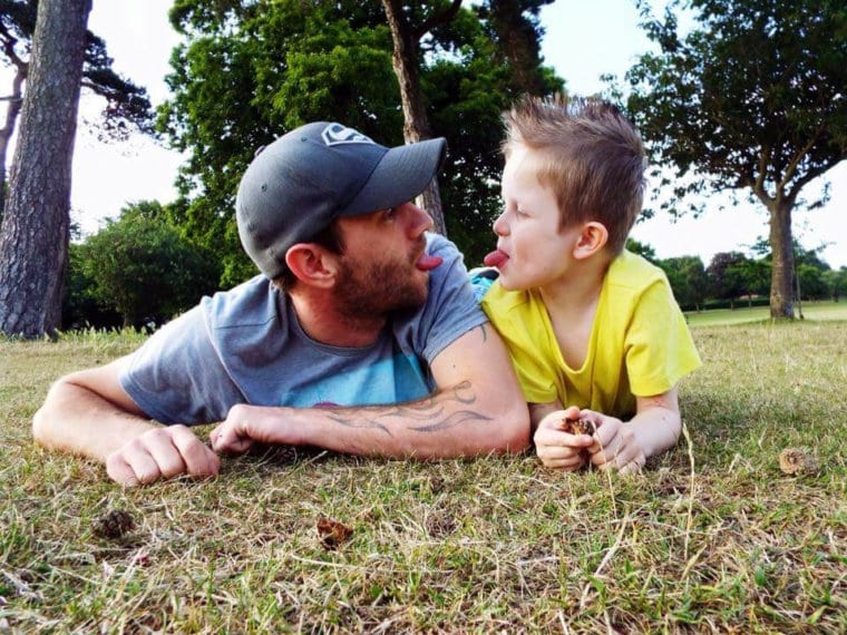 dad and boy poking tongues