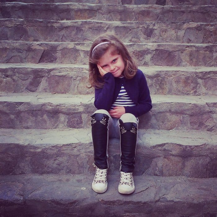 child sitting on stairs