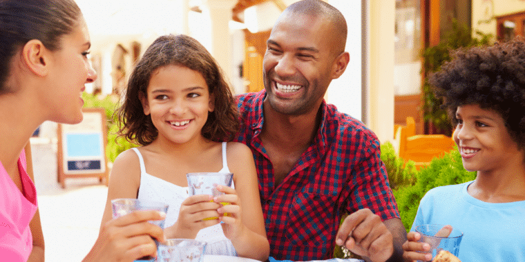 Family happily sharing a meal together