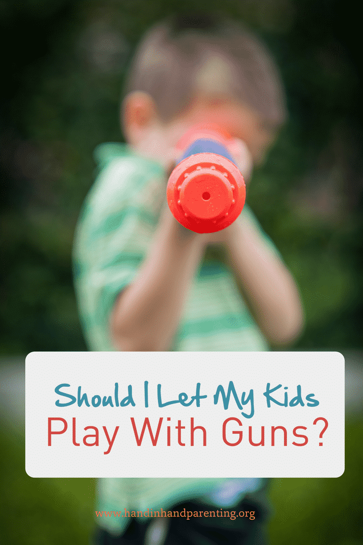 boy aiming water gun in post about how a mom made her peace with gun play