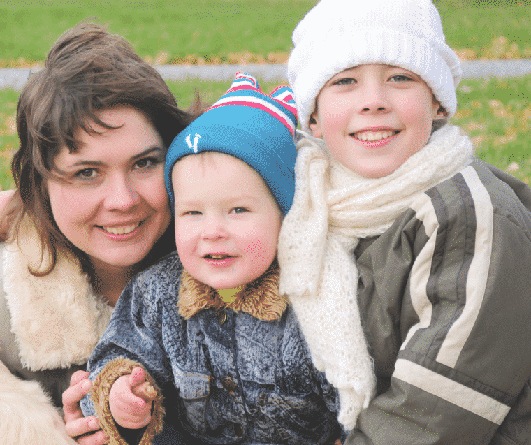 mom with two sons on windy day