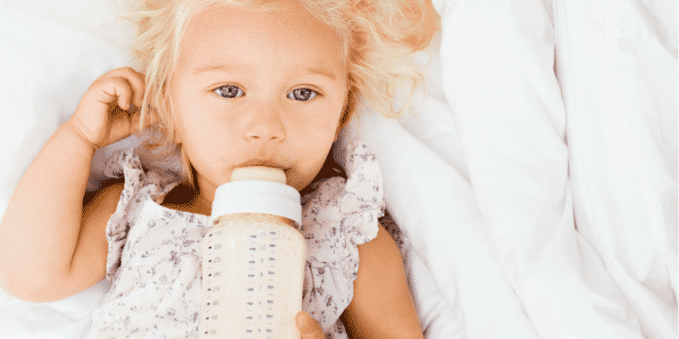Girl with baby bottle 