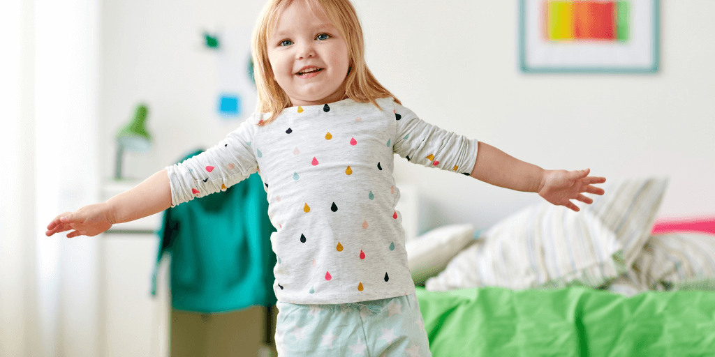 smiling girl in pyjamas