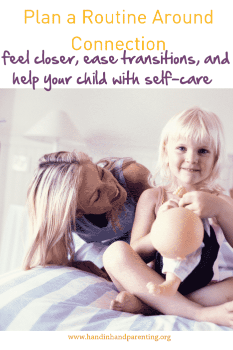 Mom and girl on bed. Girl is playing with doll. 