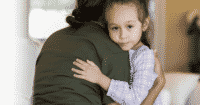 Mom hugging child after her pet died