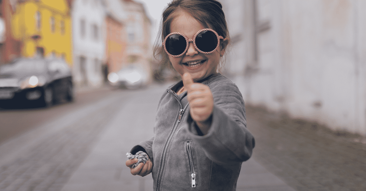 Motivated child with thumbs up
