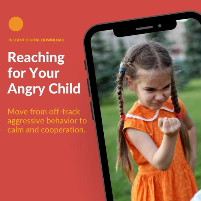 Child appearing angry, making a fist at someone