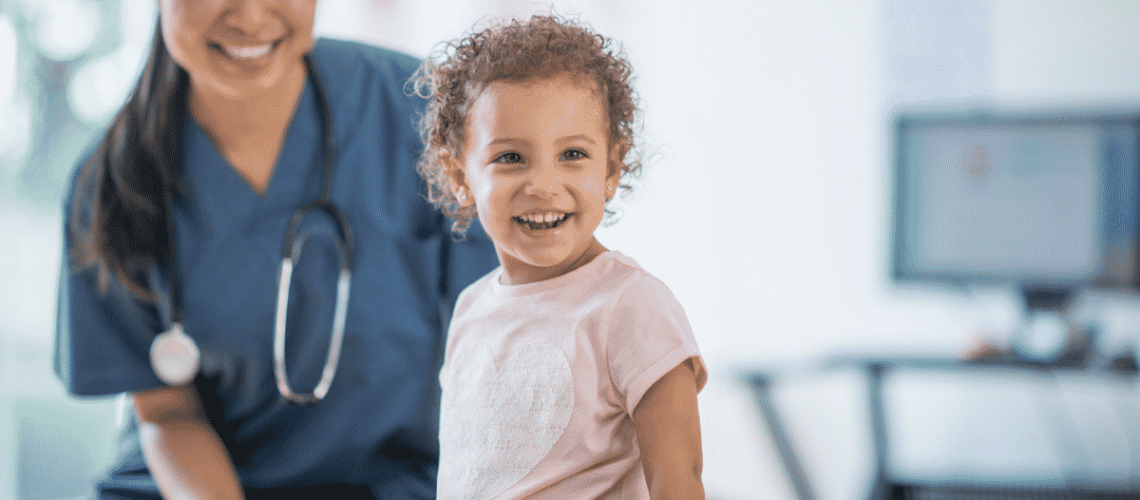 Happy child with doctor has no vaccines fears