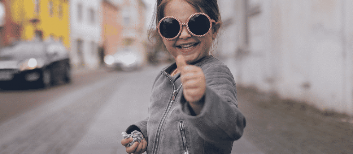 Motivated child with thumbs up